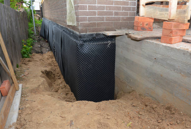 SJ Waterproofing Pros technician performing targeted Basement Waterproofing assessment in Bayport, NY